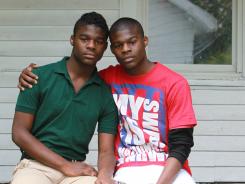 Darnell "Dynasty" Young, left, a gay high school student in Indianapolis, is on suspension and faces possible expulsion after using a Taser to scare off a group of six kids who used gay slurs and threatened to attack him on campus. Dynasty is photographed with his twin brother, Darell.